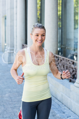 A beautiful woman running in the street