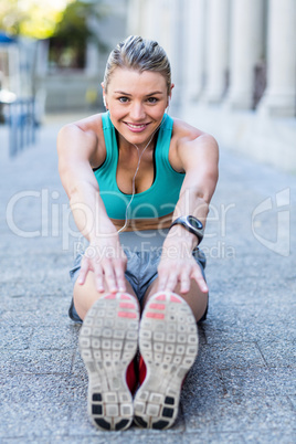 A beautiful woman stretching her leg