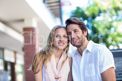 Smiling couple sitting closely together