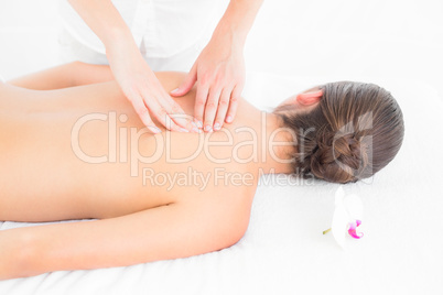 Pretty brunette enjoying a massage