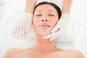 Attractive young woman on massage table