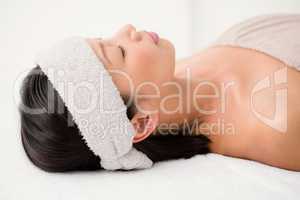Relaxed woman lying on the massage table