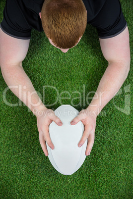 A rugby player scoring a try