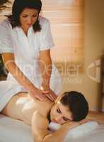 Young woman getting back massage