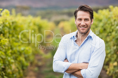 Happy vintner with crossed arms