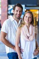 Smiling couple looking at camera