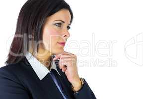 Brunette businesswoman thinking with hand on chin