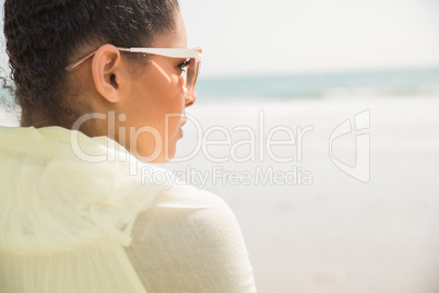 Stylish woman looking out to sea