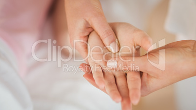 Young woman getting hand massage