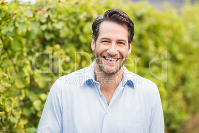 Young happy man smiling at camera