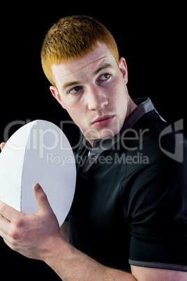 Rugby player holding a rugby ball