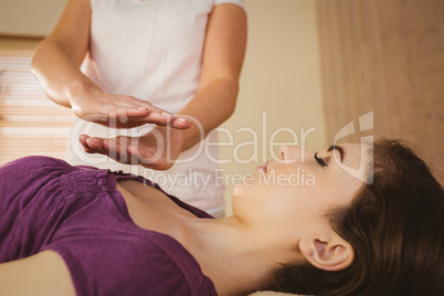 Young woman having a reiki treatment