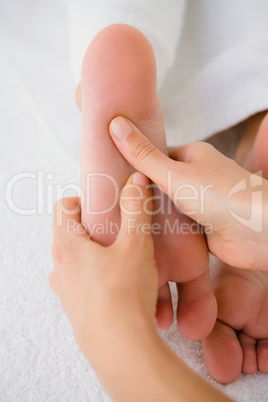 Close-up of a woman receiving foot massage