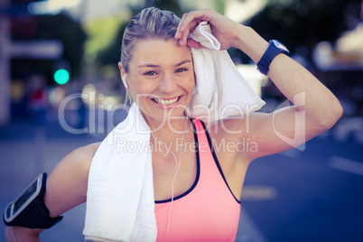 A beautiful athlete resting with a towel