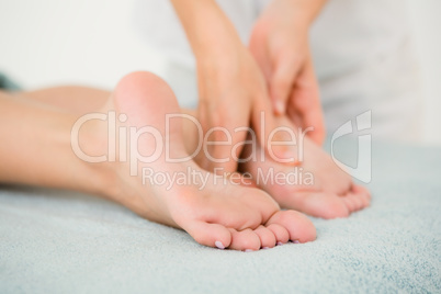 Close-up of a woman receiving foot massage