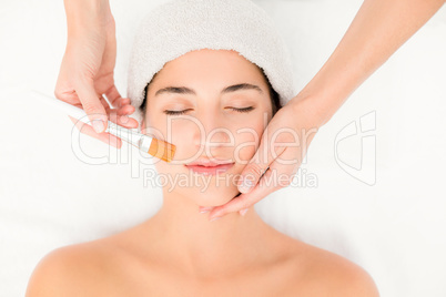 Attractive young woman receiving massage at spa center