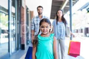 Happy family with shopping bags