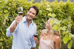 Young happy couple talking about wine