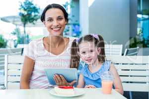 Mother and daughter using tablet computer together