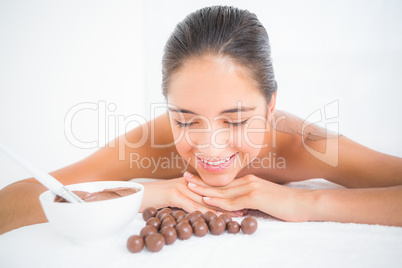 Beautiful brunette enjoying a chocolate beauty treatment