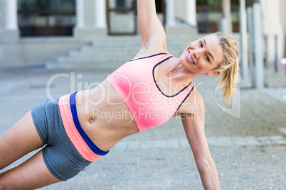 Pretty woman planking on the floor