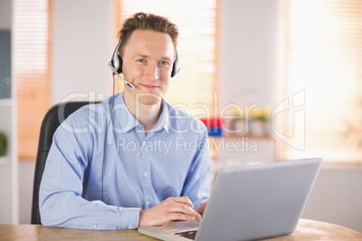 Casual businessman using headset on a call