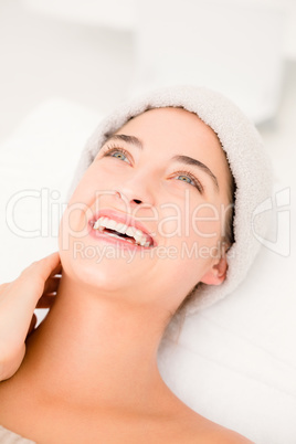 Beautiful young woman on massage table