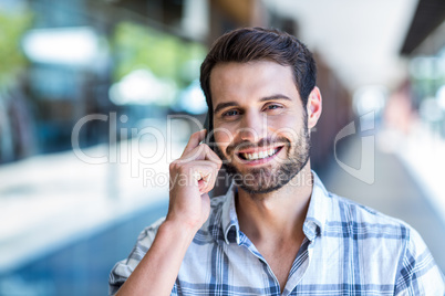 Hipster man using his smartphone in the city