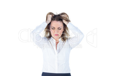 Stressed businesswoman with hands on her head