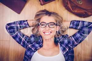 Portrait of gorgeous smiling blonde hipster lying