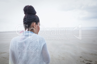Stylish woman looking out to sea