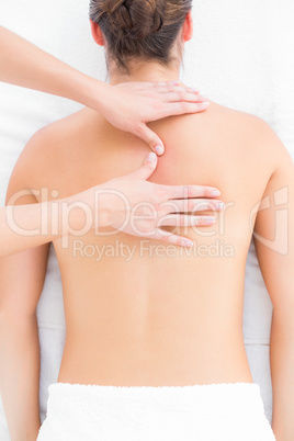 Pretty brunette enjoying a back massage