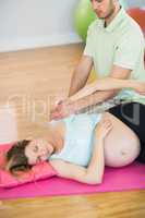 Pregnant woman enjoying relaxing massage