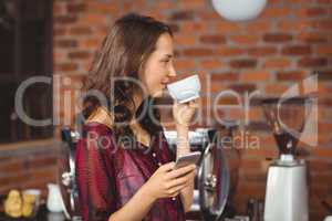 A pretty woman drinking a coffee