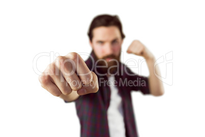 Handsome hipster punching to camera