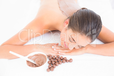 Beautiful brunette enjoying a chocolate beauty treatment