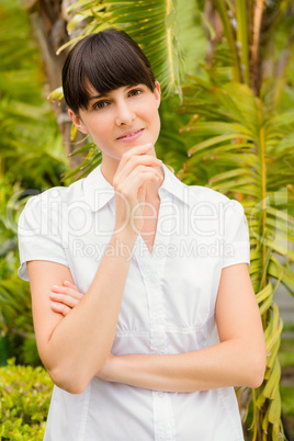 Pretty woman thoughtful looking at camera before spa day