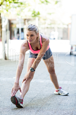 A beautiful woman stretching her leg