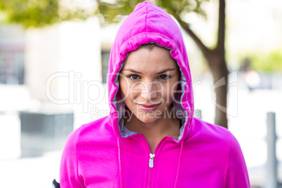 A woman wearing a pink jacket
