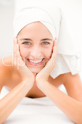 Attractive young woman on massage table