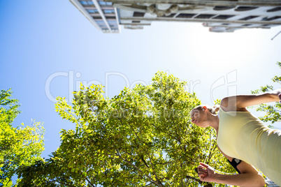 A pretty woman running in the street