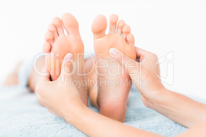 Close-up of a woman receiving foot massage