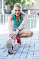 A beautiful woman stretching her leg