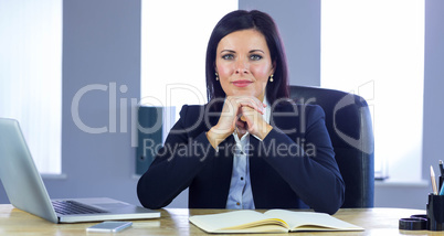Confident businesswoman smiling at camera