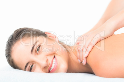 Beautiful smiling of pretty woman on massage table