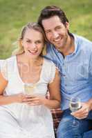 Couple on date holding a glass of white wine