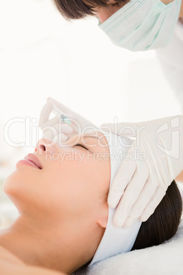 Attractive young woman on massage table