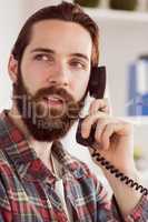 Hipster businessman making a call