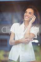 Smiling woman talking on the phone
