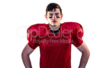 Serious american football player looking at camera